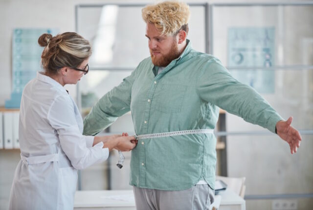 Nutritionist examining the man https://www.freepik.com/premium-photo/young-nutritionist-measuring-overweight-man-with-centimeter-tape-prescribing-diet_17635800.htm#page=2&query=clinical%20weight%20loss&position=19&from_view=search&track=ais