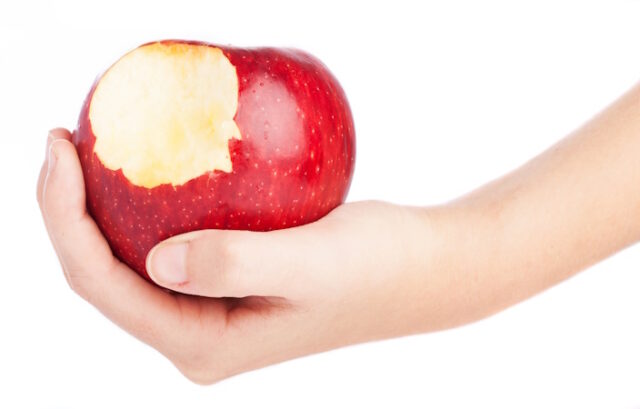 hand holding an red bitten apple isolated on a white background https://www.freepik.com/free-photo/apple-with-bite_912473.htm#query=bitten%20apple&position=11&from_view=search&track=robertav1_2_sidr