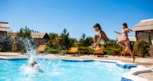 https://www.freepik.com/free-photo/cheerful-children-rejoicing-jumping-swimming-pool_7598872.htm#query=swimming&position=41&from_view=search&track=sph