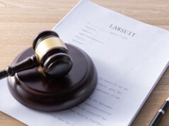 https://www.freepik.com/free-photo/high-angle-shot-gavel-lawsuit-papers-wooden-surface_25929286.htm#query=lawsuit&position=0&from_view=search&track=sph