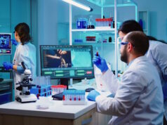 https://www.freepik.com/free-photo/microbiologist-doctor-taking-blood-sample-tube-from-rack-with-machines-analysis-lab-background_15785908.htm#query=lab%20workers&position=22&from_view=search&track=ais