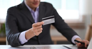 https://www.freepik.com/premium-photo/young-businessman-holding-credit-card-using-internet-banking-service-laptop-computer_27579995.htm#query=business%20credit&position=12&from_view=search&track=ais