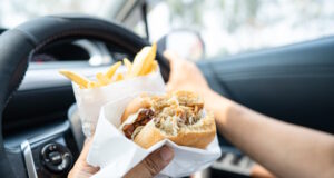 https://www.freepik.com/premium-photo/asian-lady-holding-hamburger-french-fries-eat-car-dangerous-risk-accident_42870165.htm#query=fast%20food%20drive%20thru&position=24&from_view=search&track=ais