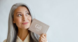 https://www.freepik.com/premium-photo/dreamful-grey-haired-asian-woman-holds-gift-card-near-face-standing-light-grey-background-studio-space-text-shopping-certificate_17813954.htm#query=adult%20gift%20cards&position=40&from_view=search&track=ais