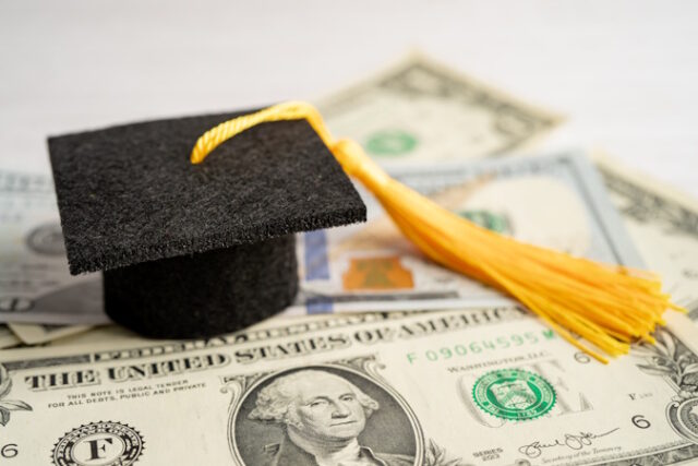 Graduation gap hat on US dollar banknotes money, Education study https://www.freepik.com/premium-photo/graduation-gap-hat-us-dollar-banknotes-money-education-study-fee-learning-teach-concept_31112559.htm#query=student%20loan&position=28&from_view=search&track=ais