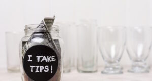 https://www.freepik.com/free-photo/glass-filled-with-money-empty-glasses-background_5683038.htm#query=tip%20money&position=2&from_view=search&track=ais