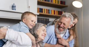 https://www.freepik.com/free-photo/medium-shot-happy-family-home_14120569.htm#query=grandkids&position=0&from_view=search&track=sph