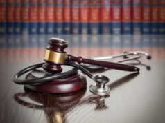 https://www.vecteezy.com/photo/16444865-gavel-and-stethoscope-on-wooden-table-with-law-books-in-background