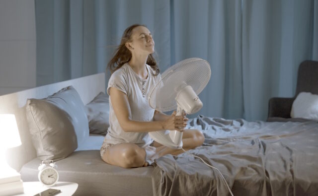Woman enjoying fresh air in front of a fan https://www.freepik.com/premium-photo/woman-her-bedroom-hot-summer-night-she-is-enjoying-fresh-air-front-fan_60164873.htm#query=heatwave&position=13&from_view=search&track=sph