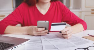 https://www.freepik.com/free-photo/unrecognizable-female-model-red-sweater-sits-working-table-surrounded-with-papers-laptop-computer_8988194.htm#query=credit%20check&position=34&from_view=search&track=ais