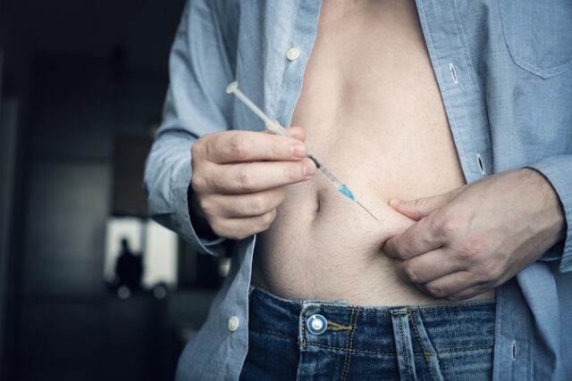 injecting insulin at home. young man hand using insulin syringe close up . self-medication https://www.freepik.com/premium-photo/injecting-insulin-home-young-man-hand-using-insulin-syringe-close-up-selfmedication_39311879.htm#query=ozempic&position=24&from_view=search&track=sph