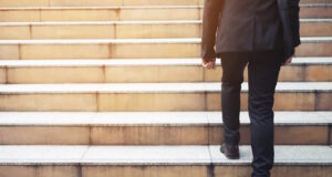 https://www.vecteezy.com/photo/10585045-ambitious-businessman-going-up-staircase-back-turned