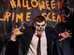 https://www.vecteezy.com/photo/15244865-portrait-of-man-that-is-on-the-thematic-halloween-party-in-scary-skeleton-makeup-and-costume-against-crime-scene-wall