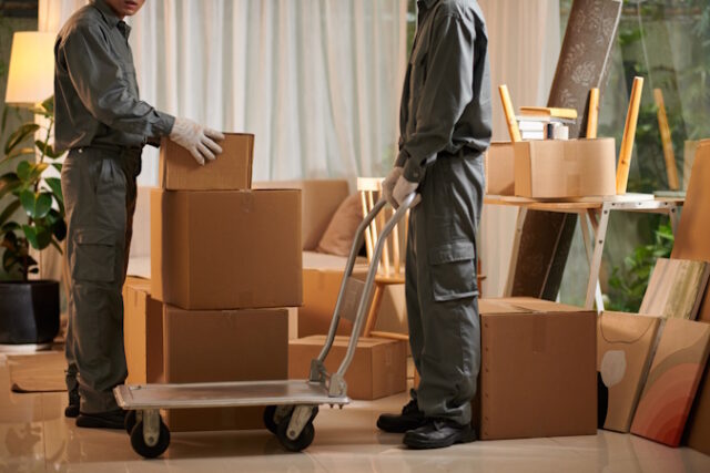 Movers Putting Boxes on Boving Cart https://www.freepik.com/premium-photo/movers-putting-boxes-boving-cart_34930669.htm#query=moving&position=22&from_view=search&track=sph