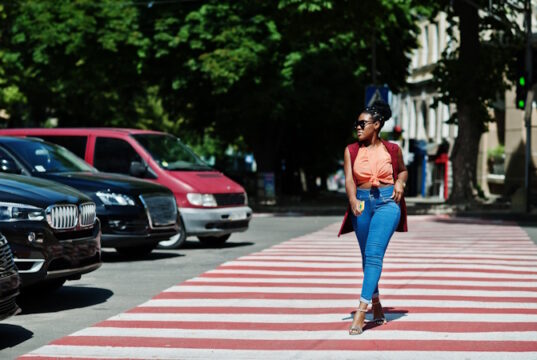 https://www.vecteezy.com/photo/10492618-stylish-african-american-woman-walking-on-crosswalk-or-pedestrian-crossing-with-mobile-phone-at-hand