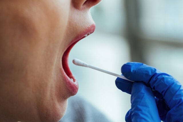 Close-up of COVID-19 patient testing. https://www.freepik.com/free-photo/closeup-patient-getting-tested-coronavirus-disease_26143914.htm#query=saliva%20test&position=2&from_view=search&track=ais&uuid=8f9a4f53-95d0-43ea-9c25-75b4fe10d9f2