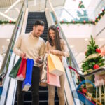 Loving couple doing Christmas shopping together