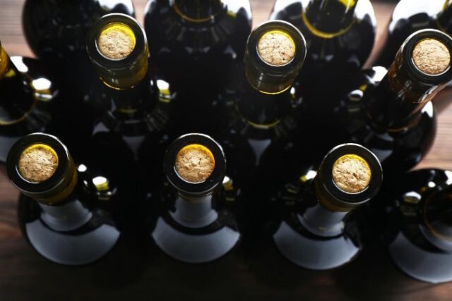 wepik-export-20240128212135WQVH https://www.freepik.com/premium-photo/stacks-wine-bottles-wooden-background-upside-view-close-up_85886018.htm#query=premium%20wines&position=10&from_view=search&track=ais&uuid=b1a03829-d1e7-4629-bac8-ad6999ce745d