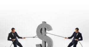 Money pulled 2 ways Photo 77670623 © Gearstd | Dreamstime.com