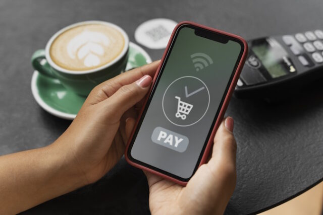 person-paying-using-nfc-technology https://www.freepik.com/free-photo/person-paying-using-nfc-technology_34226494.htm#fromView=search&page=1&position=26&uuid=3a8fc173-2979-4f20-92f3-bd32c3a26485