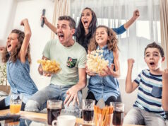 https://www.vecteezy.com/photo/27604584-family-watching-sports-match-on-tv-at-home-cheering-and-shouting-goal-with-hands-up-spilling-chips-and-popcorn-from-excitement