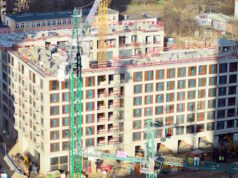 https://www.vecteezy.com/photo/36369603-high-rise-building-under-construction-installation-of-glass-facade-panels-on-a-reinforced-concrete-structure