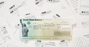 https://www.vecteezy.com/photo/15039603-refund-check-on-many-tax-form-blanks-lies-on-table-close-up-tax-payers-paperwork-routine-and-bureaucracy-concept