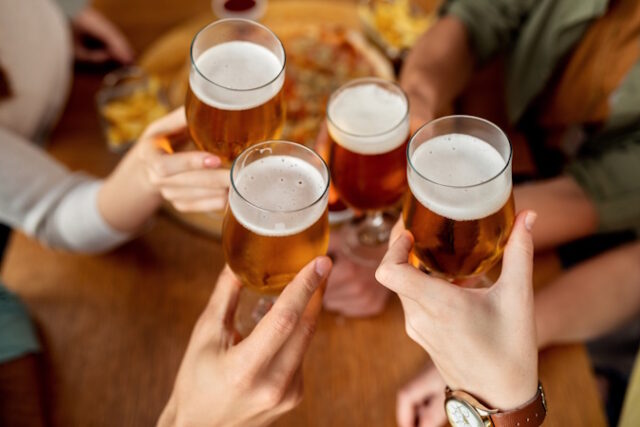 Close-up of friends toasting with beer. https://www.freepik.com/free-photo/closeup-friends-toasting-with-beer_26401831.htm#fromView=search&page=1&position=18&uuid=12709660-3283-41e8-bf53-cf5b839159a2
