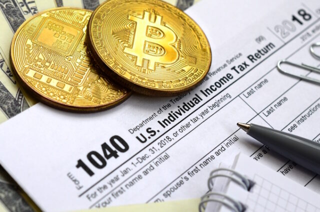 The pen, bitcoins and dollar bills is lies on the tax form 1040 Crypto Tax https://www.vecteezy.com/photo/12583057-the-pen-bitcoins-and-dollar-bills-is-lies-on-the-tax-form-1040-u-s-individual-income-tax-return-the-time-to-pay-taxes