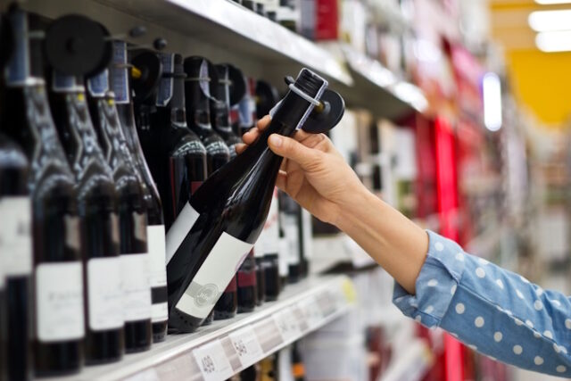 https://www.vecteezy.com/photo/6907005-woman-is-buying-a-bottle-of-wine-at-the-supermarket-background
