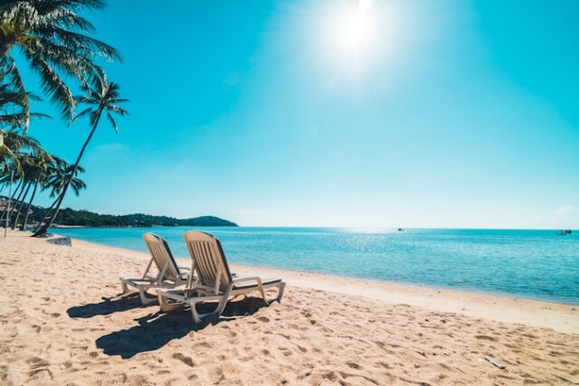 Beautiful tropical beach and sea with chair on blue sky https://www.freepik.com/free-photo/beautiful-tropical-beach-sea-with-chair-blue-sky_4188236.htm#fromView=search&page=1&position=21&uuid=c89042eb-c9fe-4da6-b982-eb4656730228
