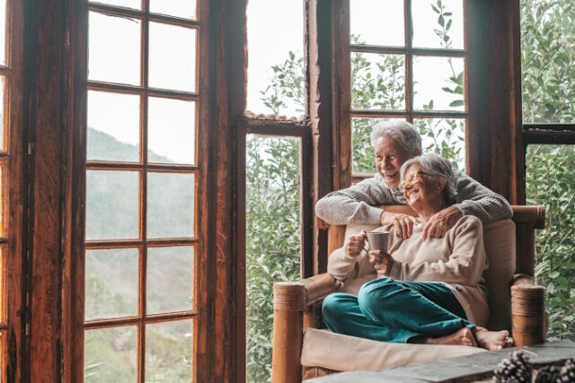 Happy old caucasian couple spending leisure time looking out thr https://www.freepik.com/premium-photo/senior-couple-enjoying-home_101662331.htm#fromView=search&page=1&position=25&uuid=139a83c8-55df-4c93-84b9-e75a0a7ec0cf