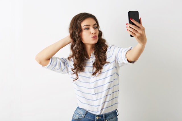 https://www.vecteezy.com/photo/29047881-beautiful-woman-making-selfie-photo-on-mobile-phone-smiling-islolated-winking