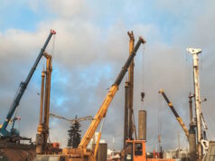 https://www.vecteezy.com/photo/14710739-construction-equipment-at-the-overpass-repair-site-large-concrete-blocks-are-erected-by-cranes-and-other-construction-equipment-repair-of-the-bridge-in-the-city-center