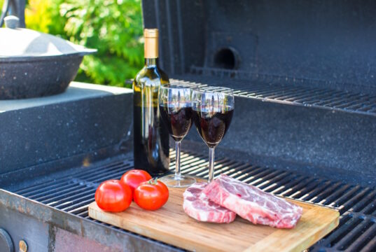 https://www.vecteezy.com/photo/18238414-fresh-meat-vegetables-and-bottle-of-wine-on-barbecue-outdoors