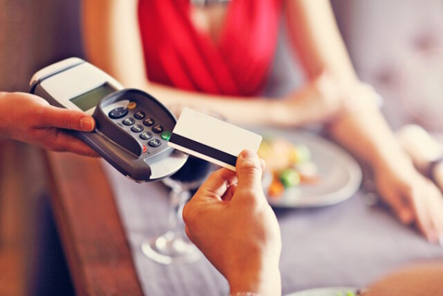 People paying in restaurant by credit card reader https://www.vecteezy.com/photo/15875180-people-paying-in-restaurant-by-credit-card-reader