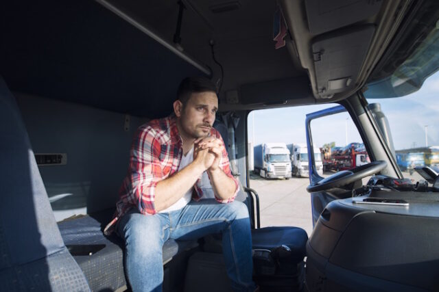 Truck driver sitting in his cabin and thinking about his family. https://www.freepik.com/free-photo/truck-driver-sitting-his-cabin-thinking-about-his-family_11450898.htm#fromView=search&page=1&position=0&uuid=dc071c8a-a10c-47d7-8791-f3f1f1af8d02