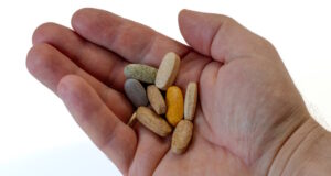 https://www.vecteezy.com/photo/42347031-a-portion-of-a-dietary-supplement-of-vitamins-in-hand