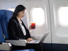 https://www.vecteezy.com/photo/42329687-asian-young-woman-using-laptop-while-drinking-coffee-at-first-class-on-airplane-during-flight-traveling-and-business-concept