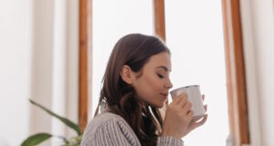 https://www.freepik.com/free-photo/young-woman-striped-shirt-drinks-coffee-from-iron-cup-against-window_13401673.htm#fromView=search&page=1&position=38&uuid=18827300-1a67-4ef4-98dc-7f519bd76173