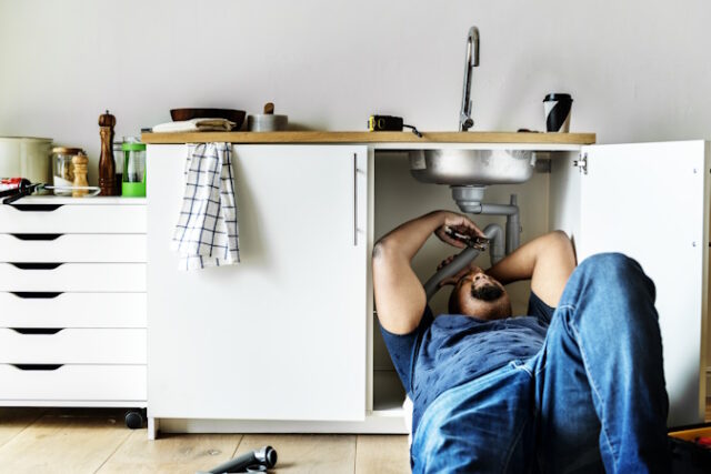 Plumber man fixing kitchen sink https://www.freepik.com/free-photo/plumber-man-fixing-kitchen-sink_2458043.htm#fromView=search&page=1&position=7&uuid=75ee1539-0d6d-4d82-94ac-4817ba19ddfc