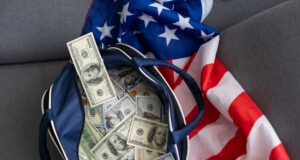 https://www.vecteezy.com/photo/42960829-an-old-black-suitcase-with-an-open-lid-full-of-one-hundred-dollar-bills-corruption