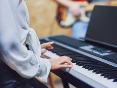 https://www.vecteezy.com/photo/15867479-caucasian-woman-playing-on-keyboard-with-band