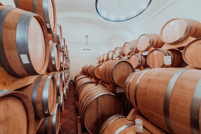 Wine or cognac barrels in the cellar of the winery, Wooden wine barrels in perspective. Wine vaults.Vintage oak barrels of craft beer or brandy. https://www.vecteezy.com/photo/31027875-wine-or-cognac-barrels-in-the-cellar-of-the-winery-wooden-wine-barrels-in-perspective-wine-vaults-vintage-oak-barrels-of-craft-beer-or-brandy