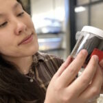 Gordon holding bed bug specimens