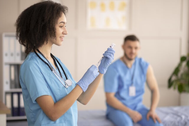 female-doctor-preparing-vaccination-her-colleague https://www.freepik.com/free-photo/female-doctor-preparing-vaccination-her-colleague_12892226.htm#fromView=search&page=1&position=29&uuid=78da966e-9def-414d-9e96-0542d65fd8e0