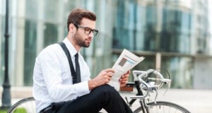 news https://www.vecteezy.com/photo/13576447-reading-the-latest-news-side-view-of-young-businessman-reading-newspaper-while-sitting-near-his-bicycle-with-office-building-in-the-background