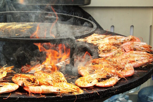 https://www.vecteezy.com/photo/35634555-seafood-slices-are-cooked-on-a-fire-pit-surface-in-the-shape-of-cone-shaped-bowl-bowl-shaped-flat-grill-with-prawns-and-shrimps-outdoor-barbecue-cooking-street-food-concept-toast-the-hot-grilled