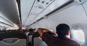 https://www.vecteezy.com/photo/11652935-man-looks-in-airplane-window-new-aircraft-cabin-with-comfortable-seats-economy-class-flight-of-new-airline-without-flight-delay