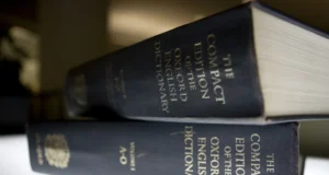 FILE- In this Aug. 29, 2010 file photo, an Oxford English Dictionary is shown at the headquarters of the Associated Press in New York. (AP Photo/Caleb Jones, File)